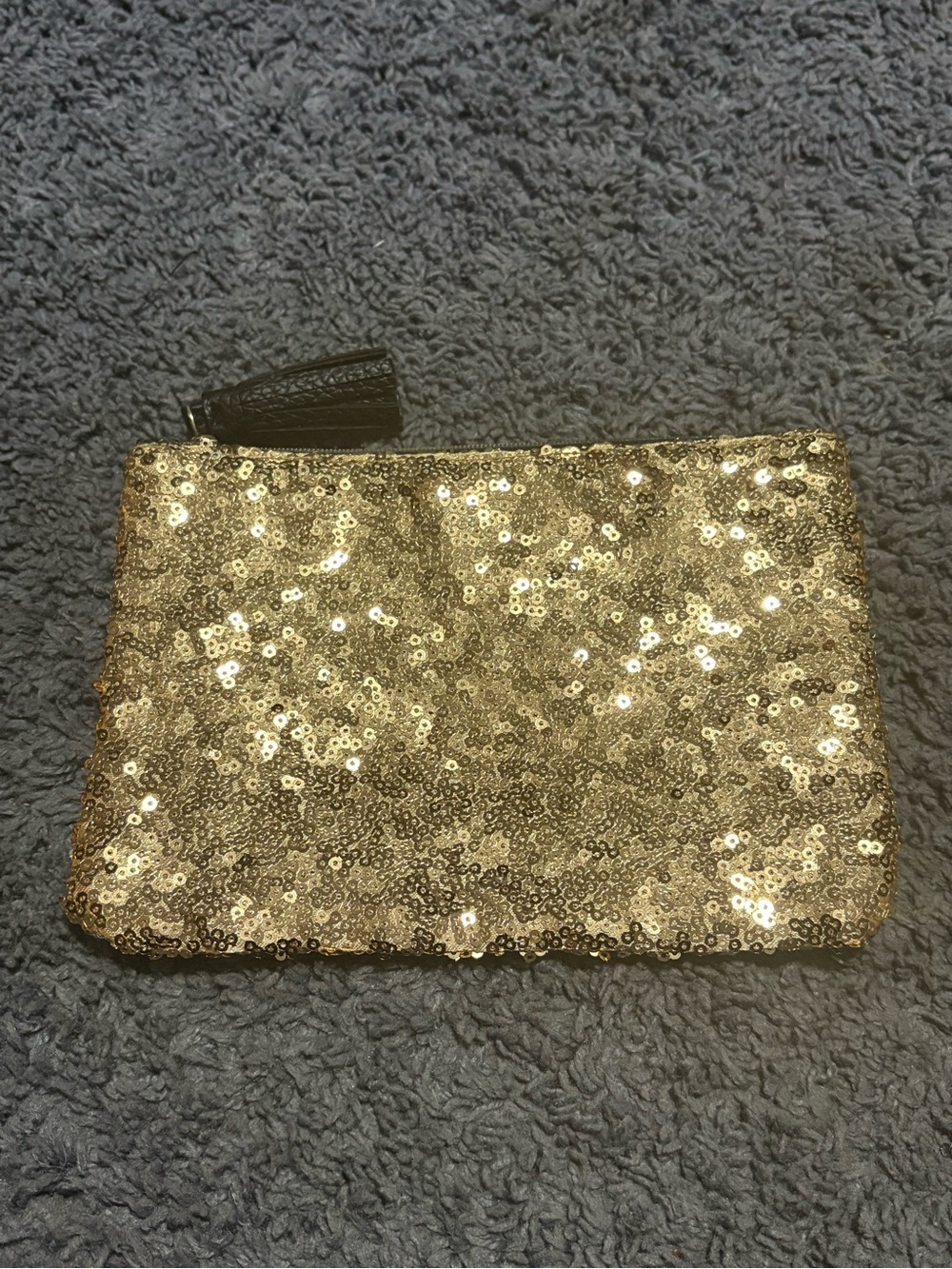 NWOT gold sequined pouch with black back and black tassel zipper